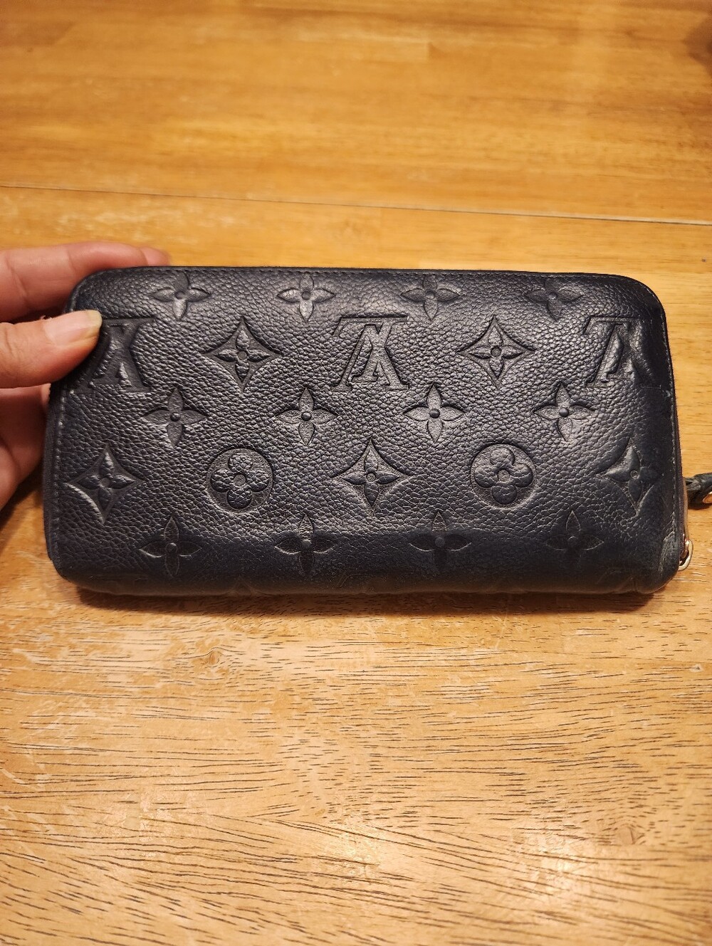 Louis Vuitton Zippy Wallet crafted from Navy Monogram Empreinte leather